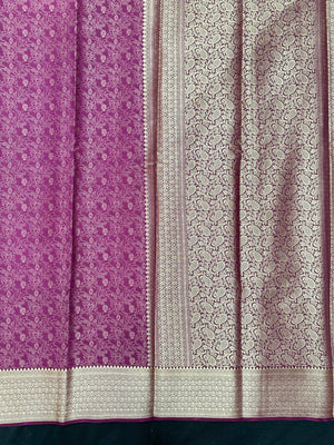 Woman wearing a Binny Crepe Saree with soft, flowing drape and minimal sheen, ideal for office and everyday wear.