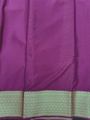 Woman wearing a Binny Crepe Saree with soft, flowing drape and minimal sheen, ideal for office and everyday wear.