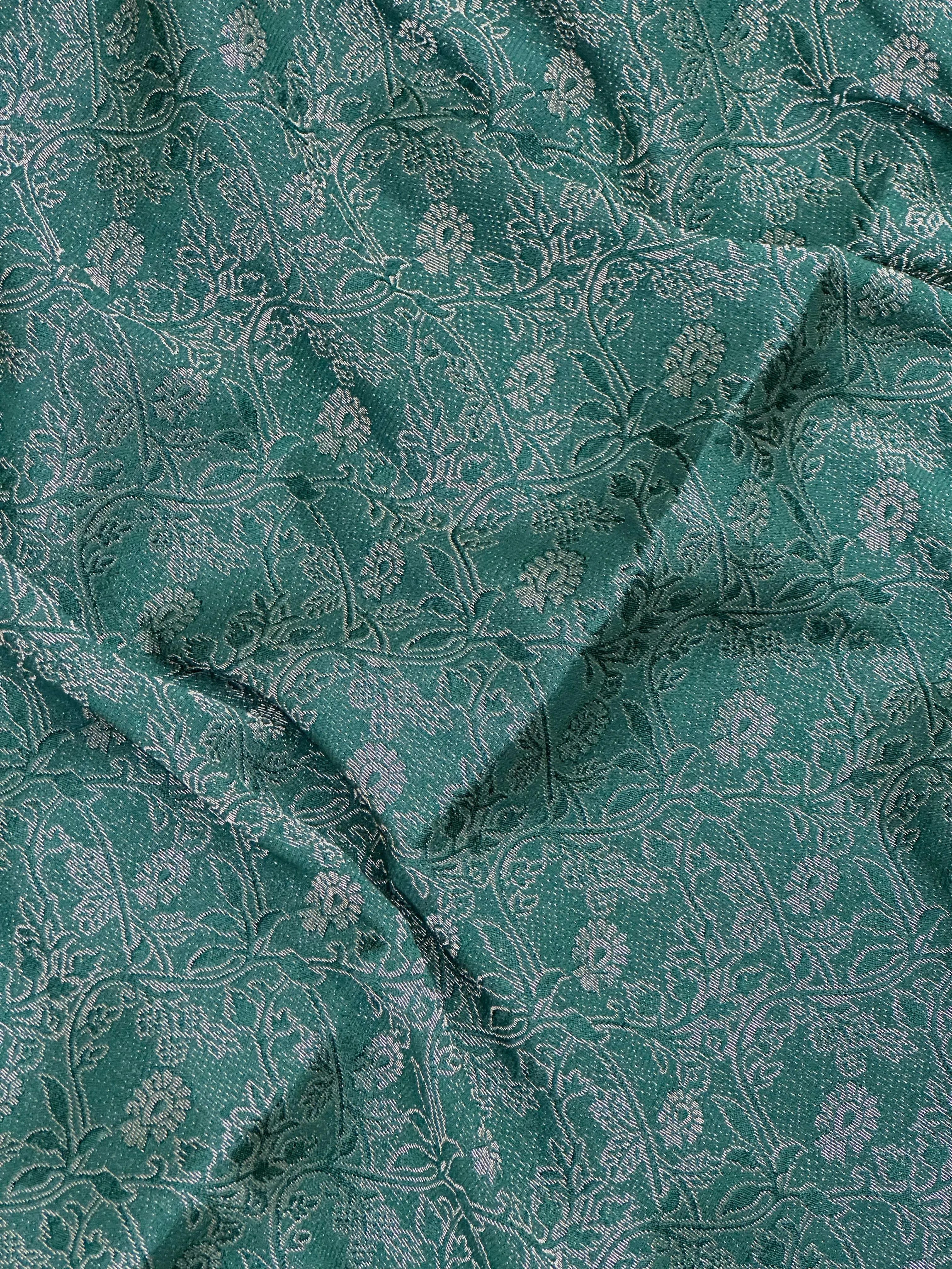 Woman wearing a Binny Crepe Saree with soft, flowing drape and minimal sheen, ideal for office and everyday wear.