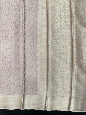 Woman wearing a Binny Crepe Saree with soft, flowing drape and minimal sheen, ideal for office and everyday wear.