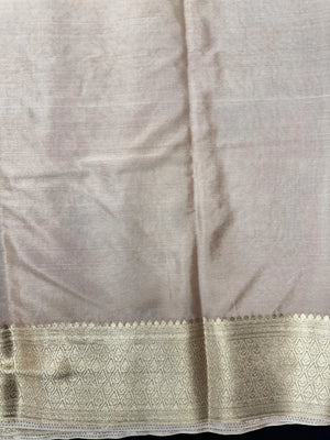 Woman wearing a Binny Crepe Saree with soft, flowing drape and minimal sheen, ideal for office and everyday wear.