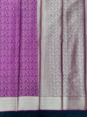 Woman wearing a Binny Crepe Saree with soft, flowing drape and minimal sheen, ideal for office and everyday wear.