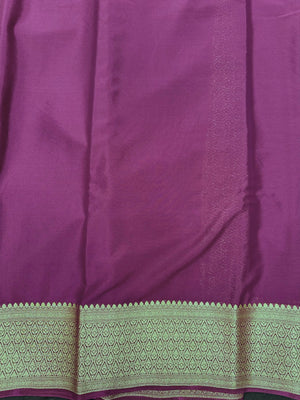 Woman wearing a Binny Crepe Saree with soft, flowing drape and minimal sheen, ideal for office and everyday wear.