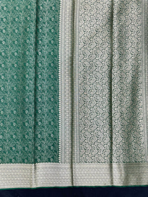 Woman wearing a Binny Crepe Saree with soft, flowing drape and minimal sheen, ideal for office and everyday wear.