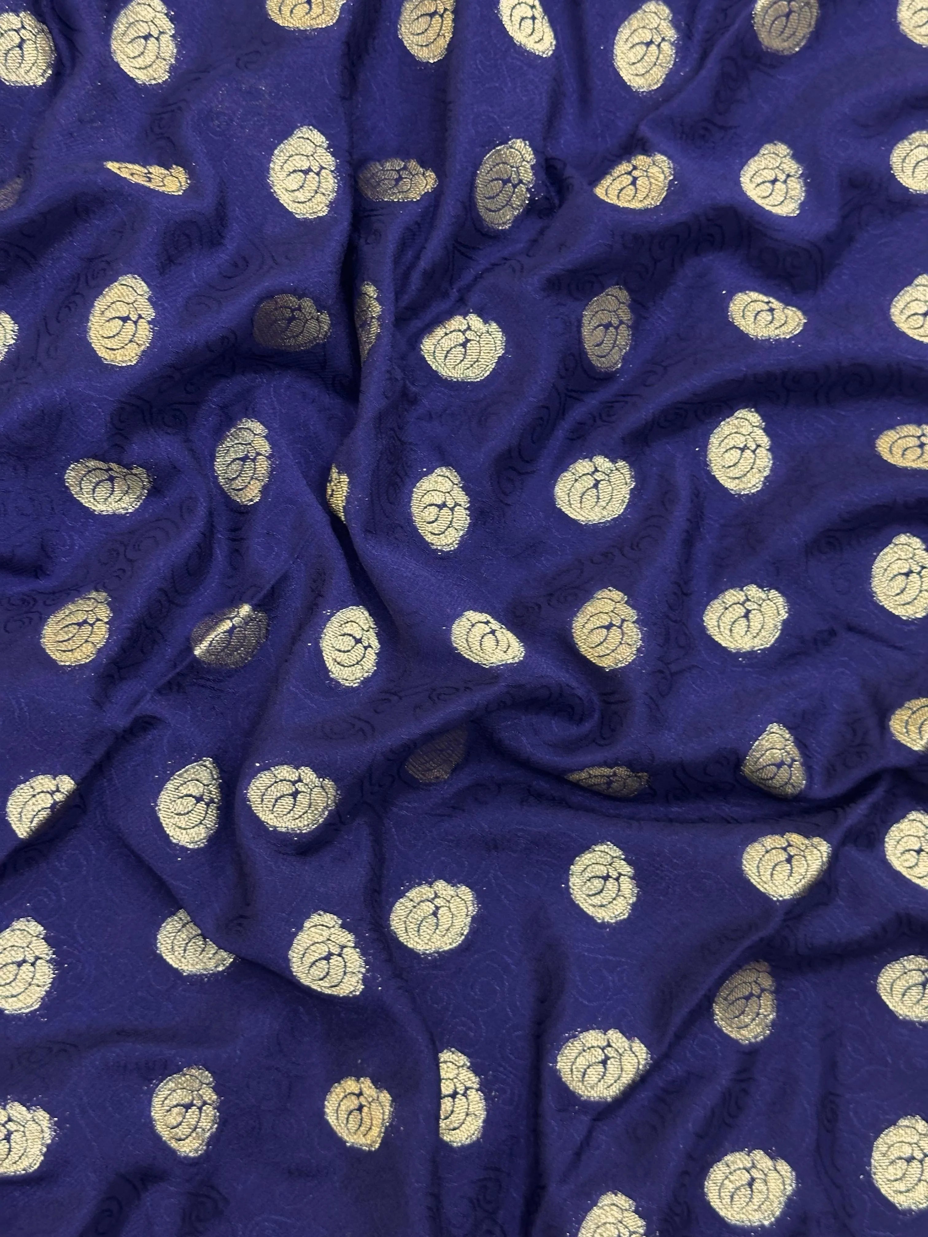 A woman wearing a stylish Binny Crepe Semi-Silk Saree with soft drape and elegant print, perfect for regular and casual wear.