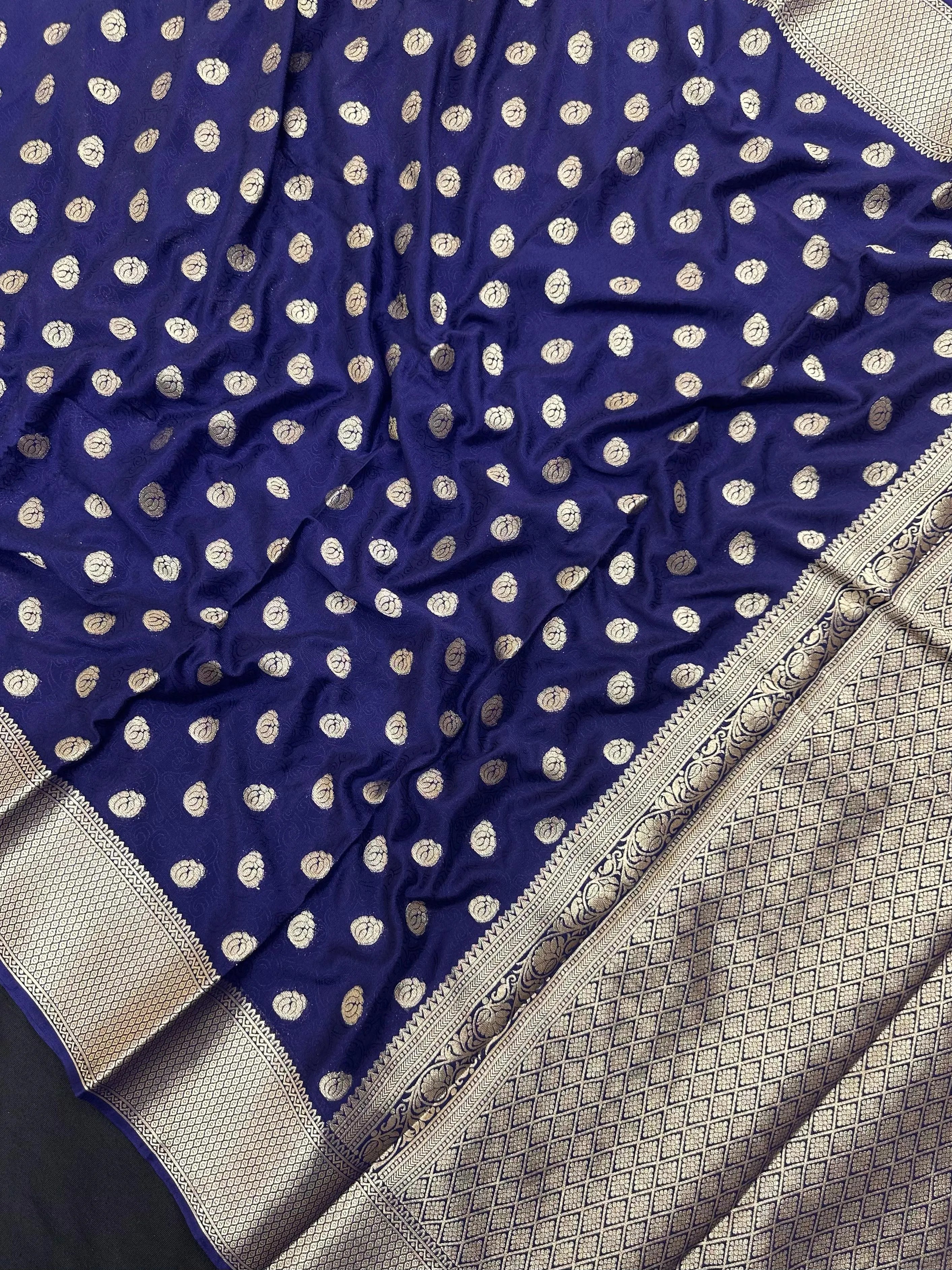 A woman wearing a stylish Binny Crepe Semi-Silk Saree with soft drape and elegant print, perfect for regular and casual wear.