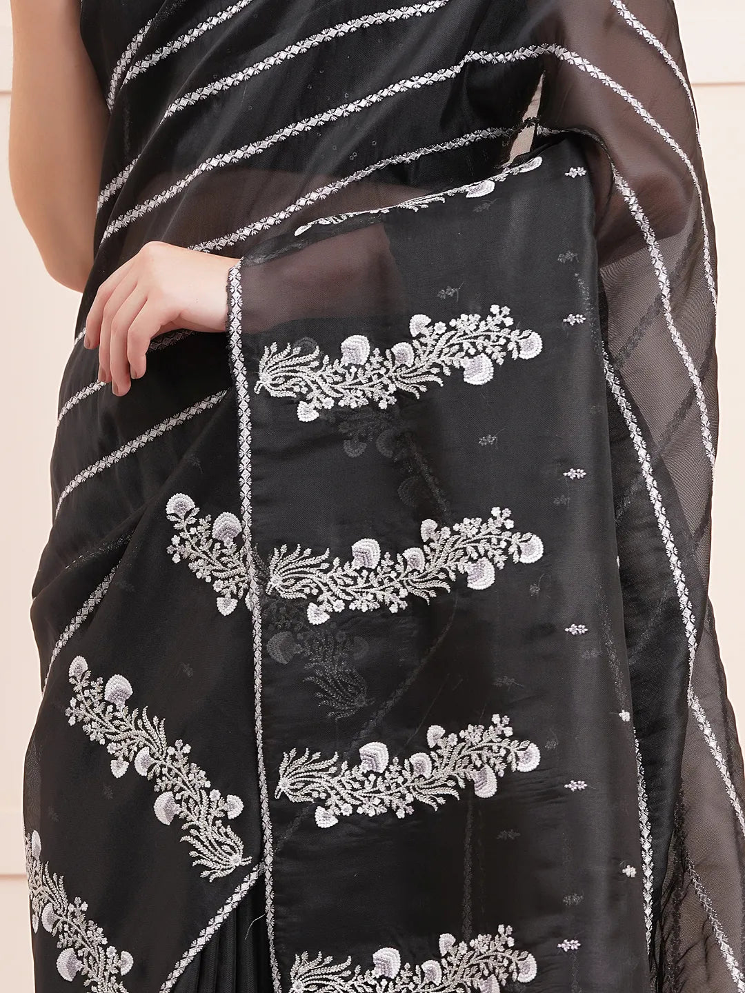 "Elegant black organza saree featuring intricate Kashmiri embroidery, perfect for fancy wear and stylish party occasions."