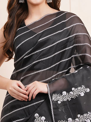 "Elegant black organza saree featuring intricate Kashmiri embroidery, perfect for fancy wear and stylish party occasions."
