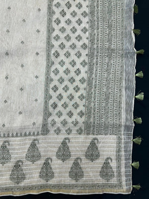 Woman wearing a Linen Silk Saree with soft, breathable texture and subtle shine, ideal for office wear and casual festive occasions.