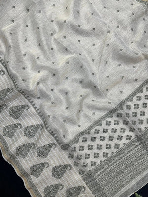 Woman wearing a Linen Silk Saree with soft, breathable texture and subtle shine, ideal for office wear and casual festive occasions.