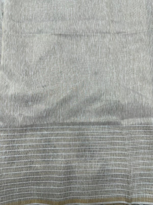 Woman wearing a Linen Silk Saree with soft, breathable texture and subtle shine, ideal for office wear and casual festive occasions.