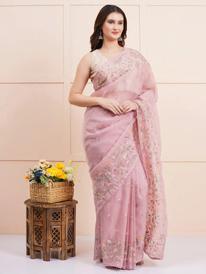 "Elegant light pink organza saree with delicate fabric and intricate details, perfect for a stylish party look and fancy wear. Ideal for formal or semi-formal occasions."