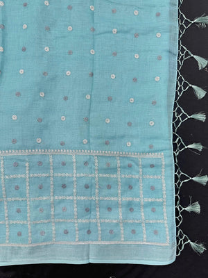 Woman draped in a Linen Silk Saree with natural texture and soft shine – perfect for elegant everyday and office wear.