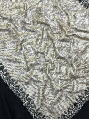 Woman wearing a Milky Cutwork Tussar Silk Saree with delicate embroidery, ideal for day functions and festive occasions.