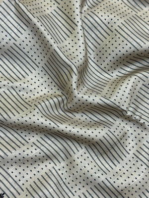 Woman wearing a Milky Cutwork Tussar Silk Saree with delicate embroidery, ideal for day functions and festive occasions.