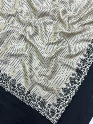 Woman wearing a Milky Cutwork Tussar Silk Saree with delicate embroidery, ideal for day functions and festive occasions.