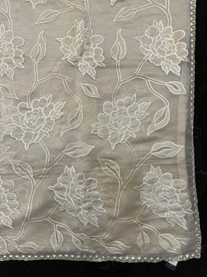 Organza saree with sheer, lightweight fabric and elegant motifs – perfect for festive and special occasions