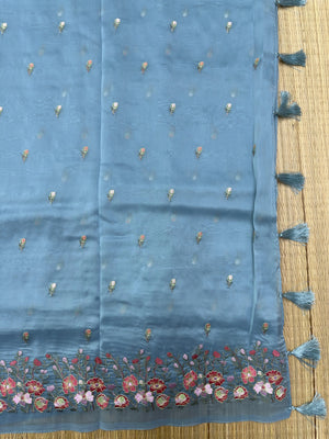 A stunning Organza Saree with a delicate sheen, designed for fancy and party wear. The lightweight, airy fabric drapes beautifully, adding glamour and elegance to any special occasion.