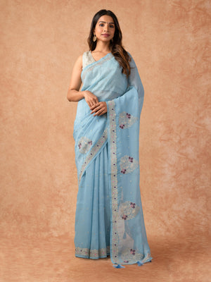 Woman wearing a Paper Silk Saree with lightweight, crisp texture and subtle sheen, ideal for office, casual, and festive occasions.