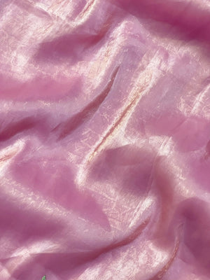 Woman wearing a Paper Silk Saree with crisp texture and elegant drape, ideal for office wear, casual events, and festive occasions.