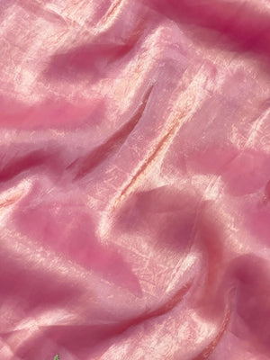 Woman wearing a Paper Silk Saree with crisp texture and elegant drape, ideal for office wear, casual events, and festive occasions.