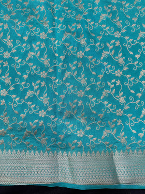 Woman wearing a Party Wear Semi Silk Saree with rich shine and elegant drape, ideal for festive events and evening parties.