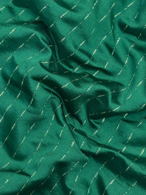 Woman wearing a Party Wear Semi Silk Saree with rich shine and elegant drape, ideal for festive events and evening parties.