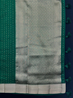 Woman wearing a Party Wear Semi Silk Saree with rich shine and elegant drape, ideal for festive events and evening parties.