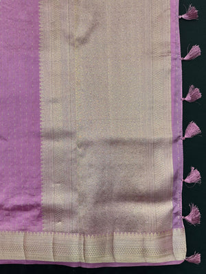 Woman wearing a Party Wear Semi Silk Saree with rich shine and elegant drape, ideal for festive events and evening parties.