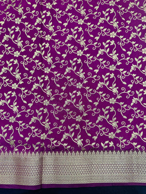 Woman wearing a Party Wear Semi Silk Saree with rich shine and elegant drape, ideal for festive events and evening parties.