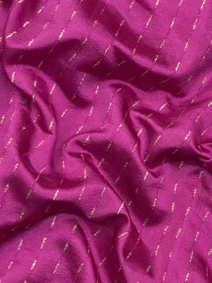 Woman wearing a Party Wear Semi Silk Saree with rich shine and elegant drape, ideal for festive events and evening parties.