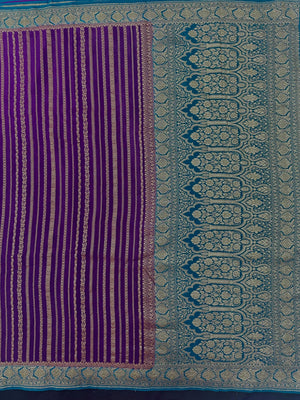 Woman wearing a Pure Banarasi Crepe Silk Saree with intricate zari motifs and flowing texture, perfect for weddings and special occasions.