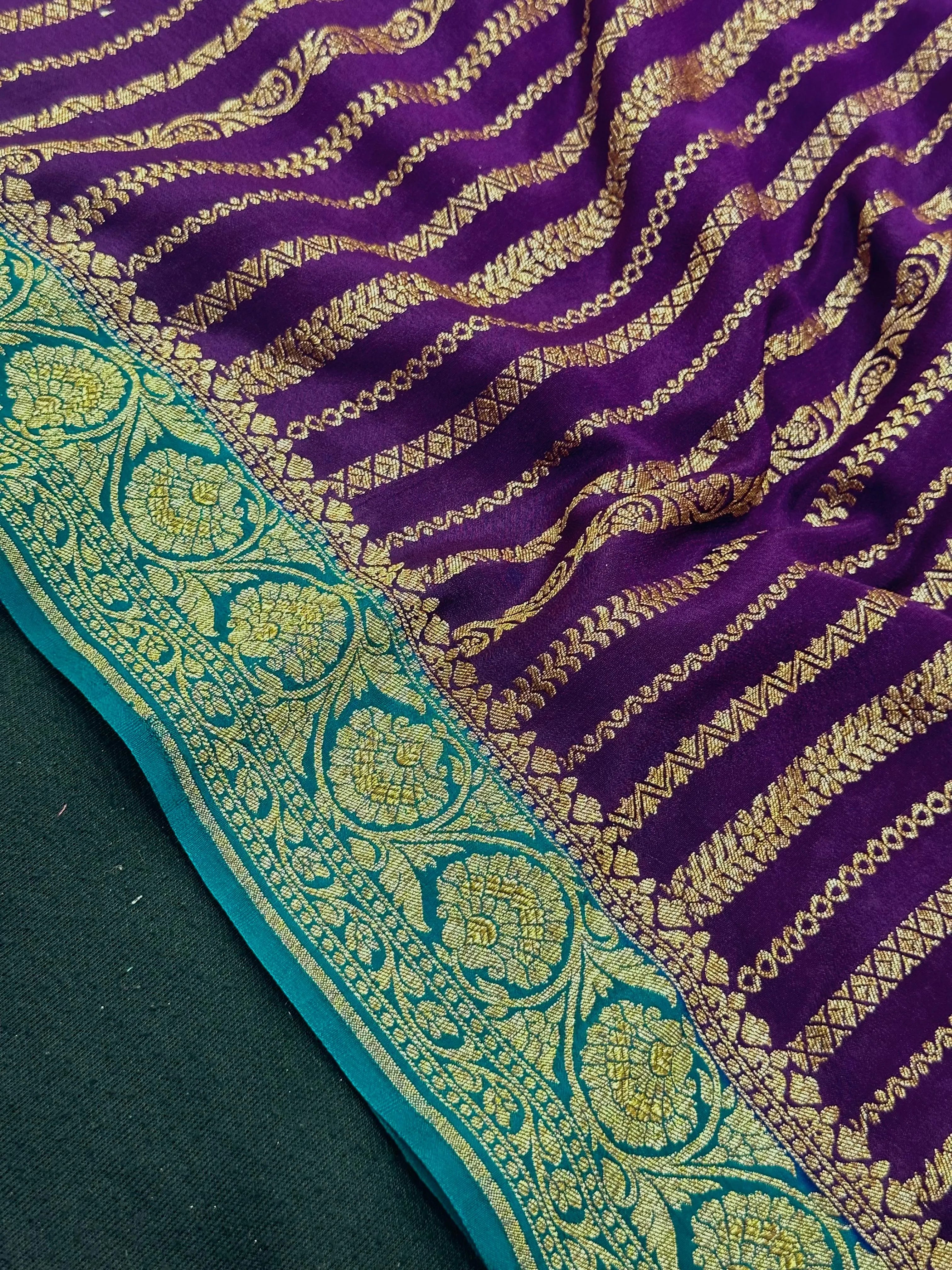 Woman wearing a Pure Banarasi Crepe Silk Saree with intricate zari motifs and flowing texture, perfect for weddings and special occasions.