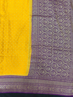 Model wearing a Pure Banarasi Crepe Silk Saree featuring rich zari motifs and a soft, flowing texture – perfect for weddings and festive events.