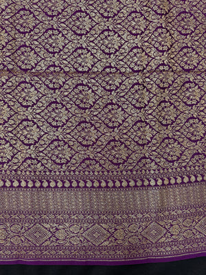 Model wearing a Pure Banarasi Crepe Silk Saree featuring rich zari motifs and a soft, flowing texture – perfect for weddings and festive events.