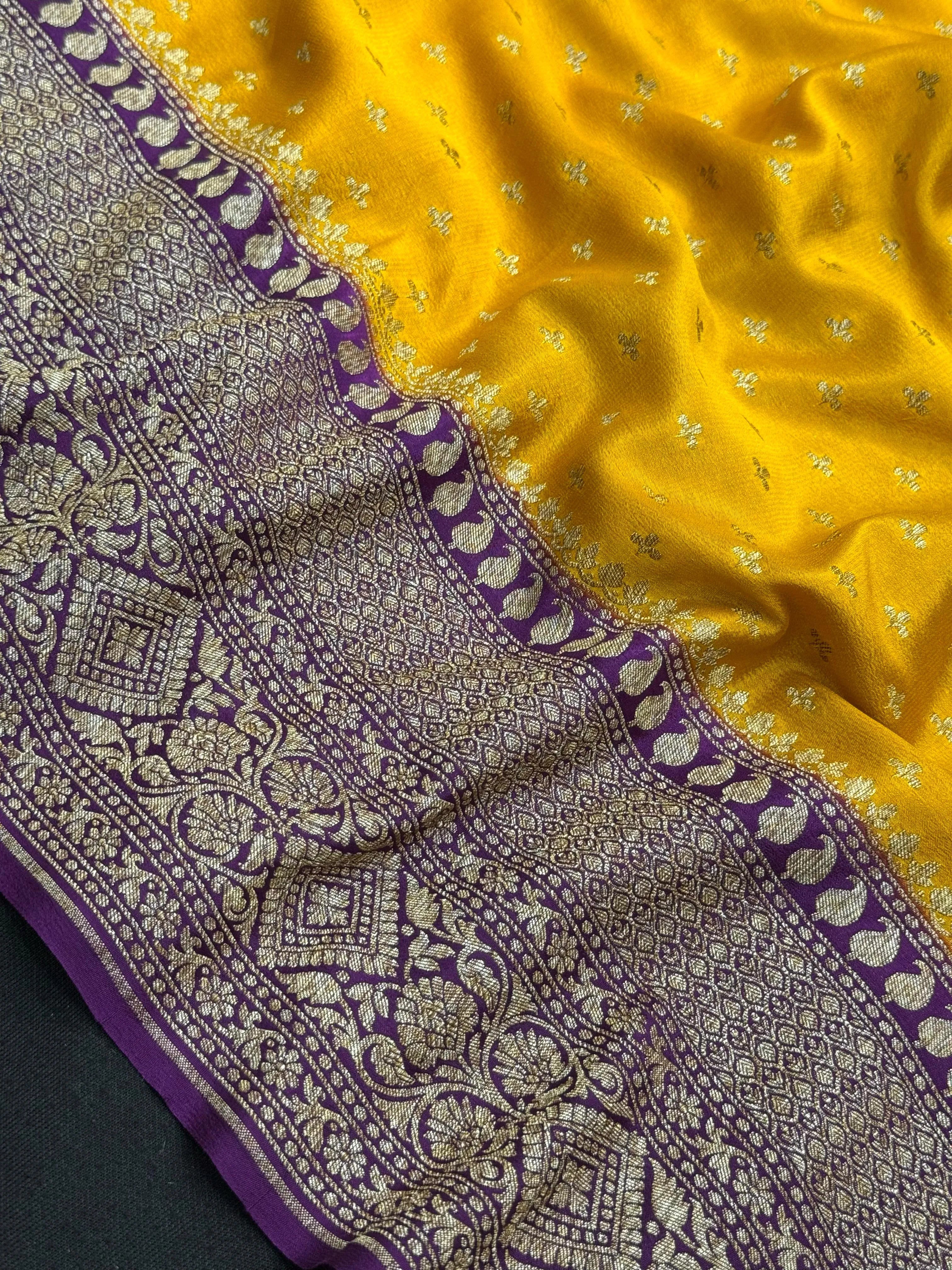 Model wearing a Pure Banarasi Crepe Silk Saree featuring rich zari motifs and a soft, flowing texture – perfect for weddings and festive events.c