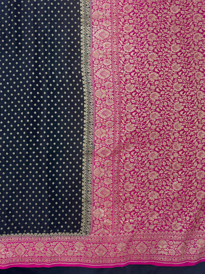 Woman draped in a Pure Banarasi Crepe Silk Saree with soft crepe texture and intricate zari work, perfect for weddings and festive occasions.