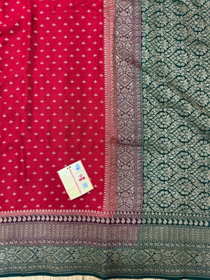 "Radiant Red Pure Banarasi Crepe Silk Saree with intricate handwoven floral and paisley motifs, perfect for weddings and celebrations. The rich red color, elegant drape, and luxurious crepe silk fabric make it an ideal choice for a traditional and festive look."