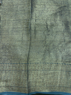 "Sleek Pure Chinya silk saree with intricate detailing, ideal for festive and wedding occasions, showcasing elegance and classic style."