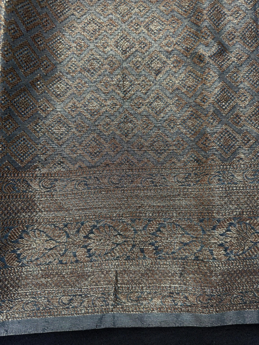 Woman wearing a traditional Chinya Silk Saree in elegant colors with woven pallu and festive motifs, ideal for weddings and Indian celebrations.