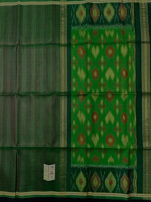 Woman wearing a Pure Dupion Silk Saree with vibrant Pochampally Ikat pallu – a stylish blend of texture and tradition.