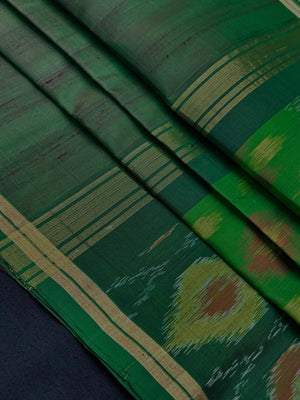 Woman wearing a Pure Dupion Silk Saree with vibrant Pochampally Ikat pallu – a stylish blend of texture and tradition.