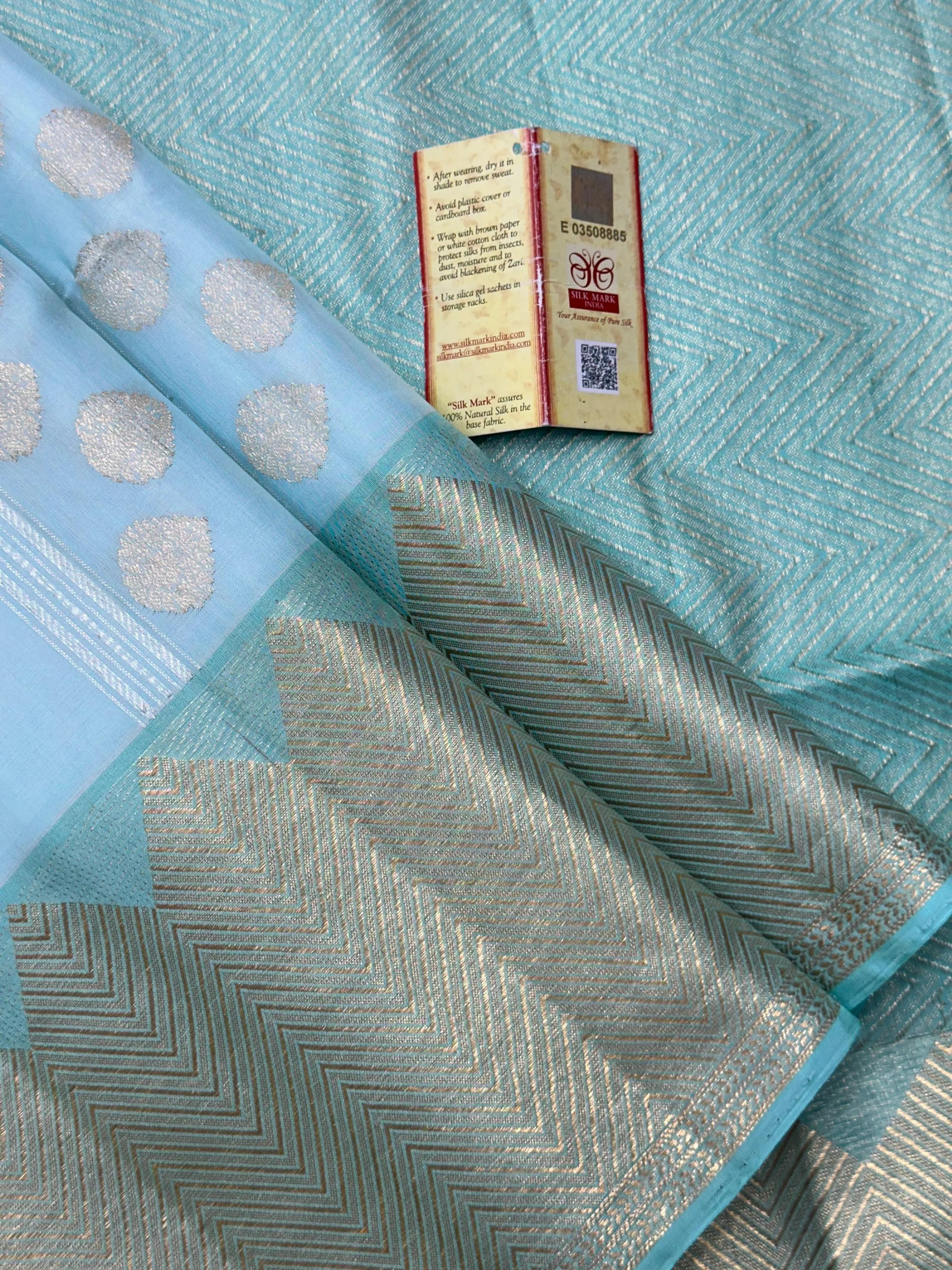 Woman draped in a Pure Kanjivaram Silk Saree with rich silk texture, vibrant colors, and traditional zari border, ideal for weddings and festivals.