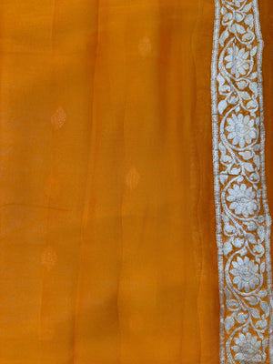 Woman wearing a Pure Khaddi Chiffon Saree with zari border and flowing drape – ideal for weddings and festive occasions.