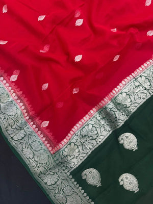 Woman wearing a Pure Khaddi Chiffon Saree with sheer, lightweight fabric and zari details, ideal for weddings and festive occasions.