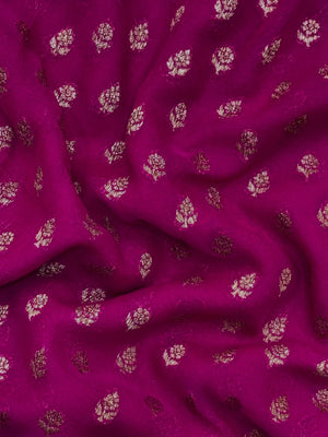 Woman wearing a Pure Khaddi Georgette Saree with rich zari work and flowing drape – ideal for festive and traditional occasions.