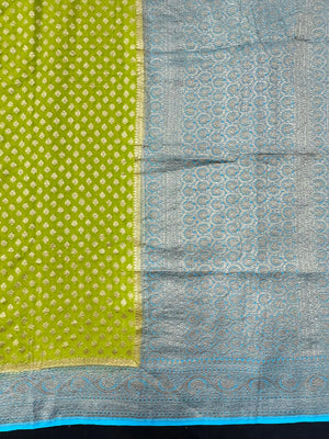 Woman draped in a Pure Khaddi Georgette Saree with intricate zari work and soft flowing texture, perfect for traditional functions and weddings.