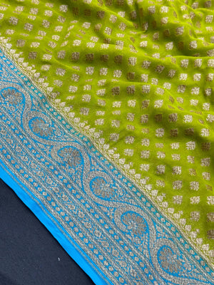 Woman draped in a Pure Khaddi Georgette Saree with intricate zari work and soft flowing texture, perfect for traditional functions and weddings.