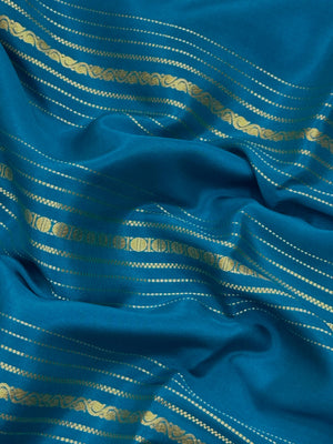 Woman wearing a Pure Mysore Silk Saree with smooth drape and zari border, perfect for weddings and traditional South Indian events.