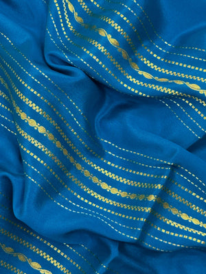 Woman wearing a Pure Mysore Silk Saree with smooth drape and zari border, perfect for weddings and traditional South Indian events.